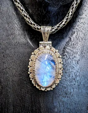 Illuminating Moonstone Pendant with Exquisite Scrollwork